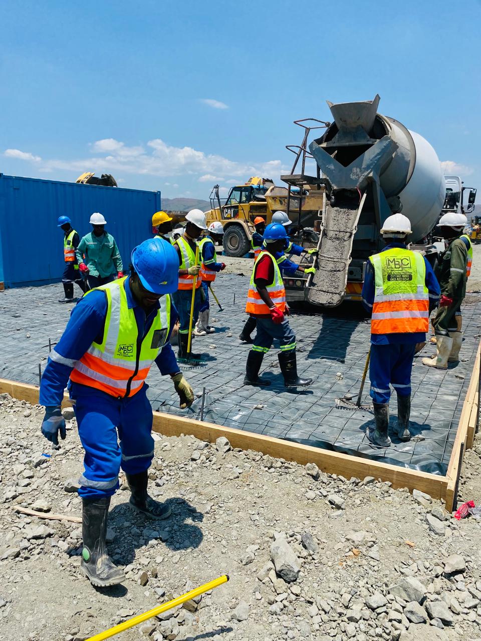 MBC crew placing reinforced concrete slab on mine site