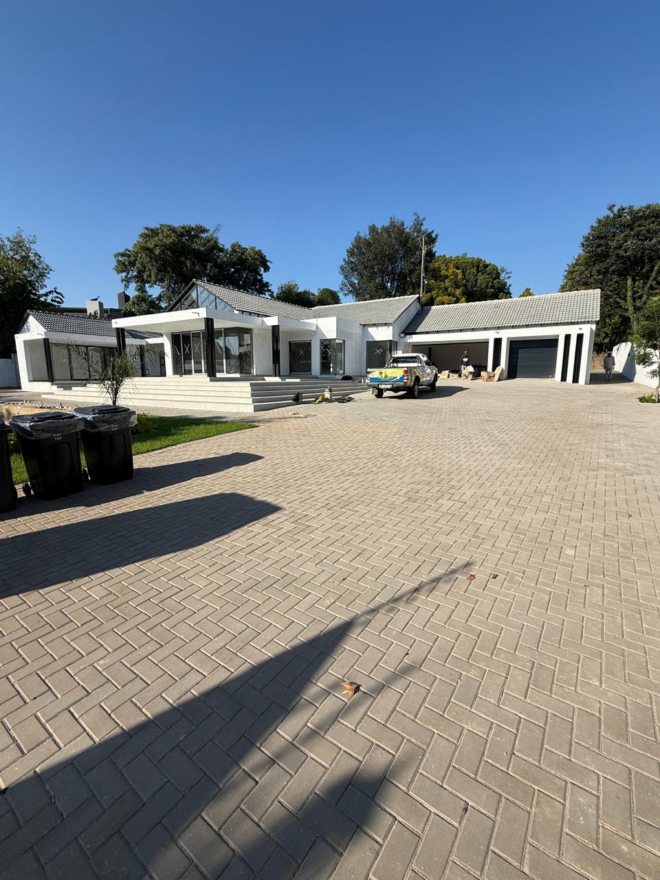 Renovated single-storey residence with new herringbone paving