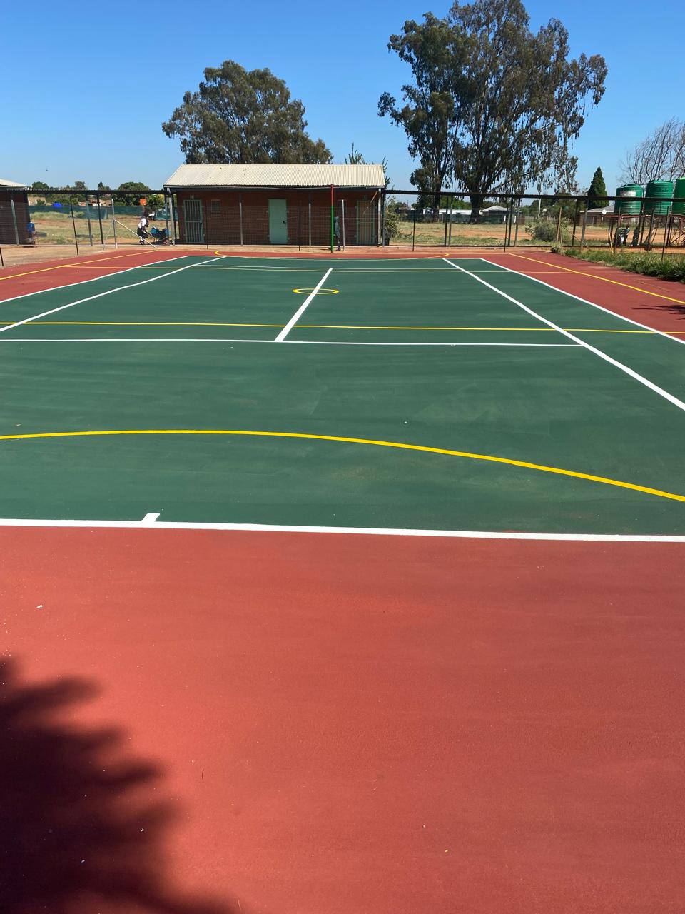 Completed multi-sport court with fresh acrylic coating