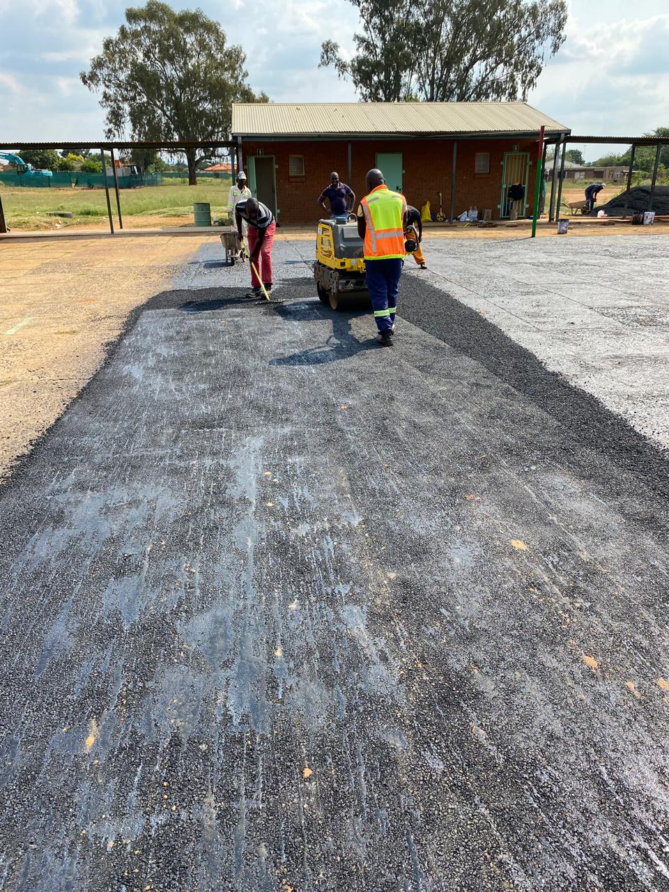 Hot-mix asphalt paving and compaction at school grounds