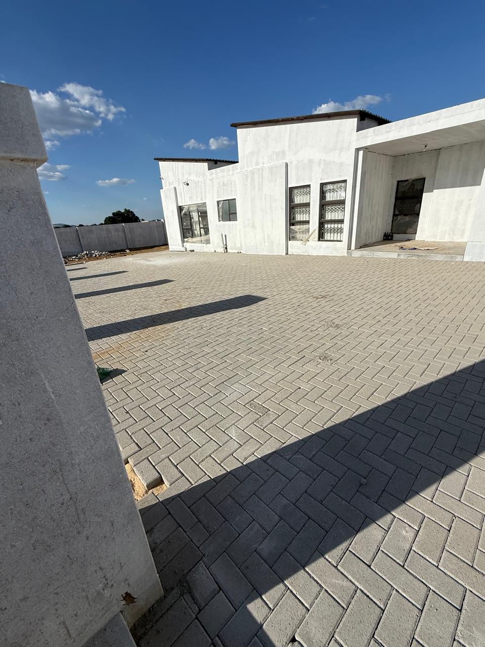 Completed commercial building with paved forecourt