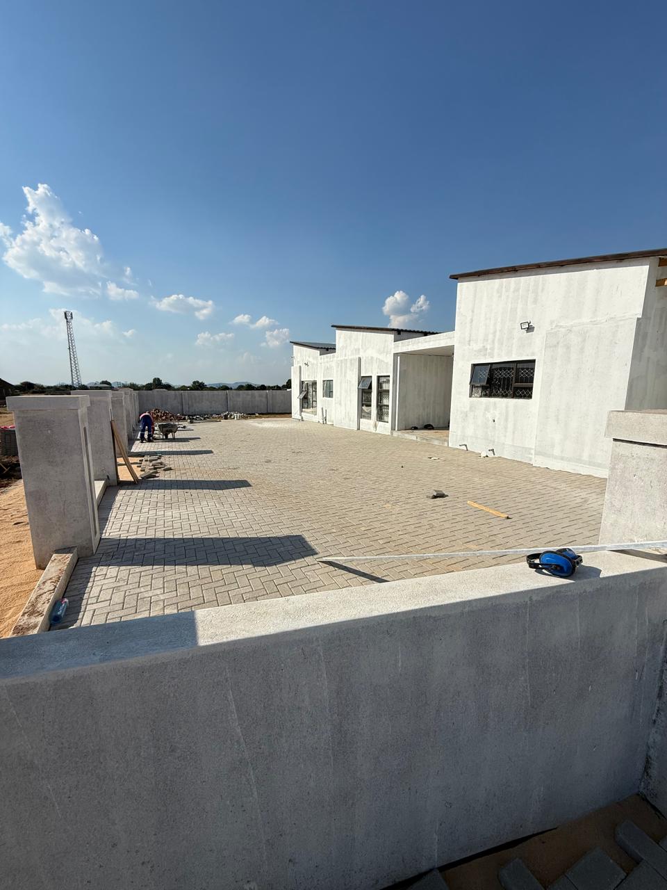 Commercial development with brick paving and boundary walls