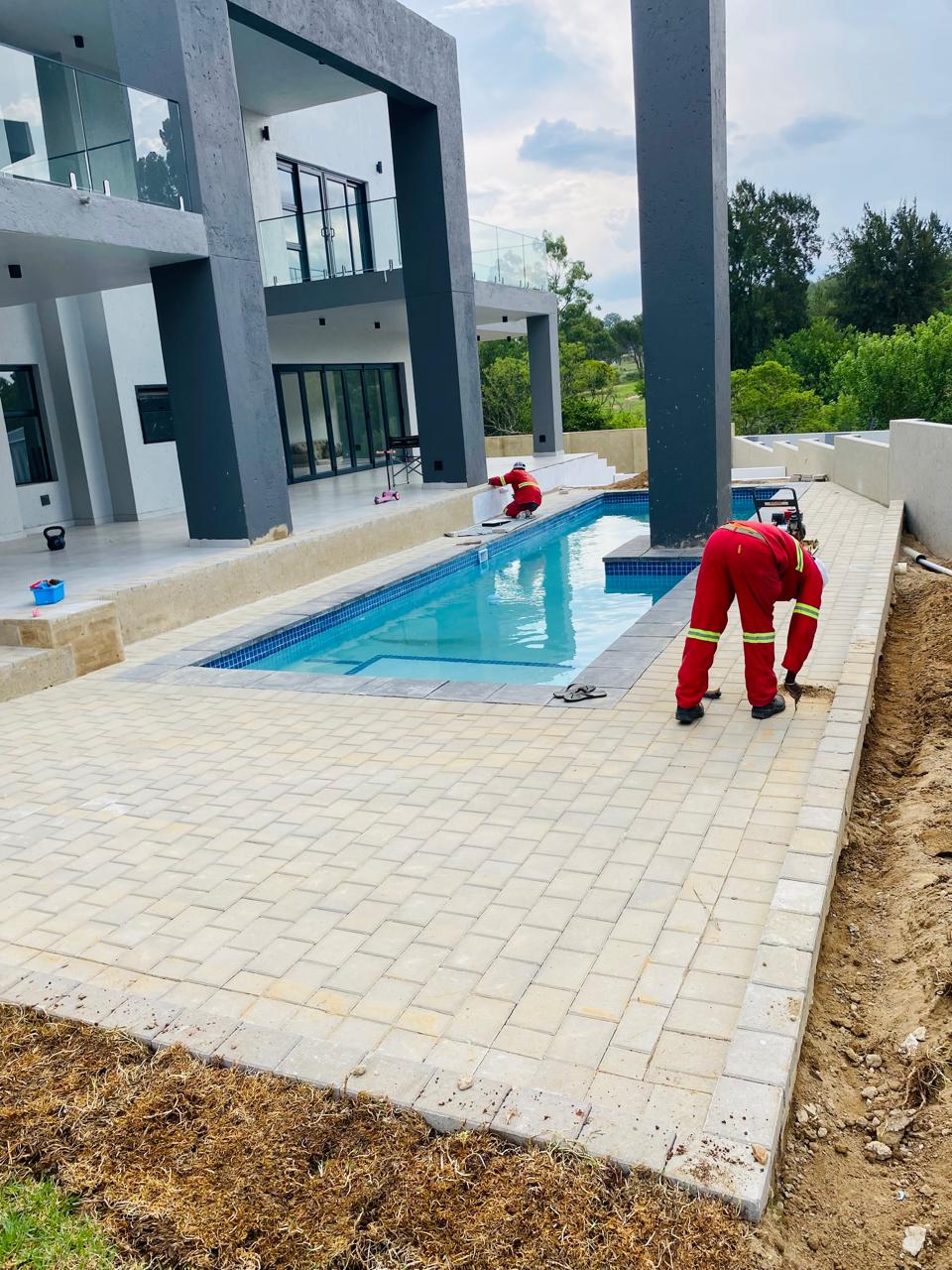 Modern lap pool with surrounding paver deck