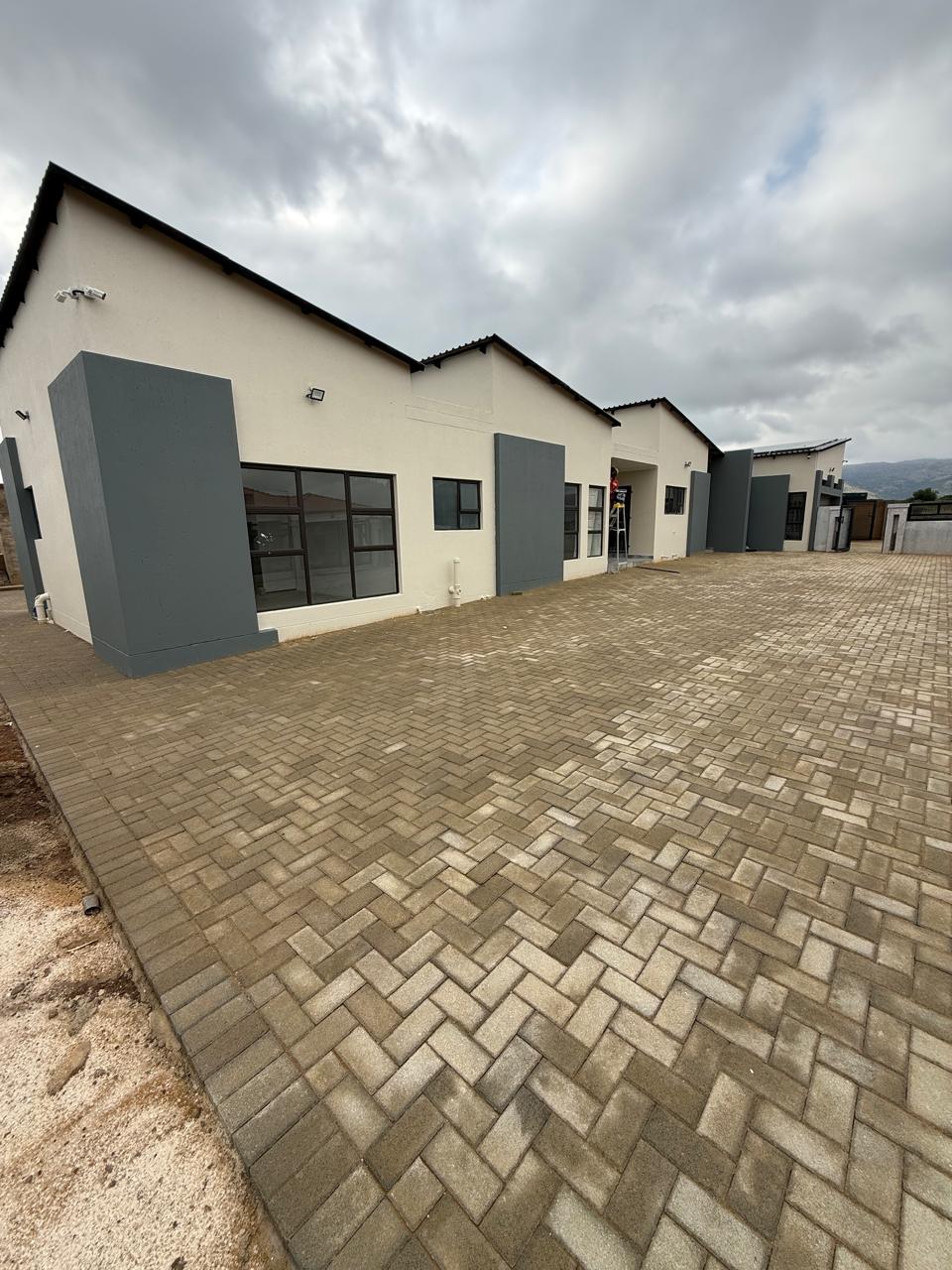 Multi-unit commercial block with herringbone paving