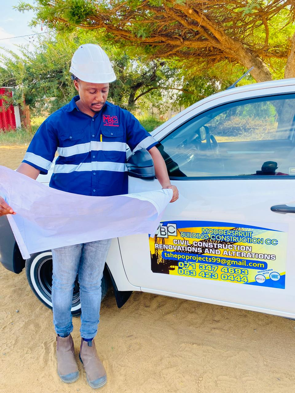 MBC foreman reviewing site blueprints